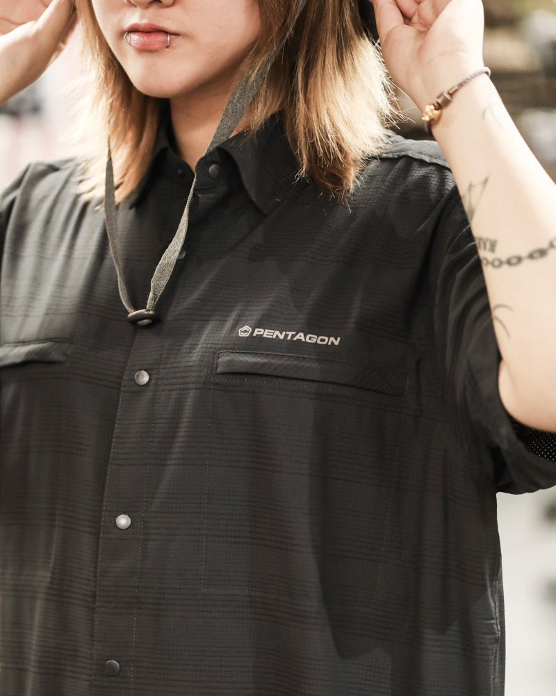 Men's short-sleeve dark shirt with front button placket, chest pocket, and logo