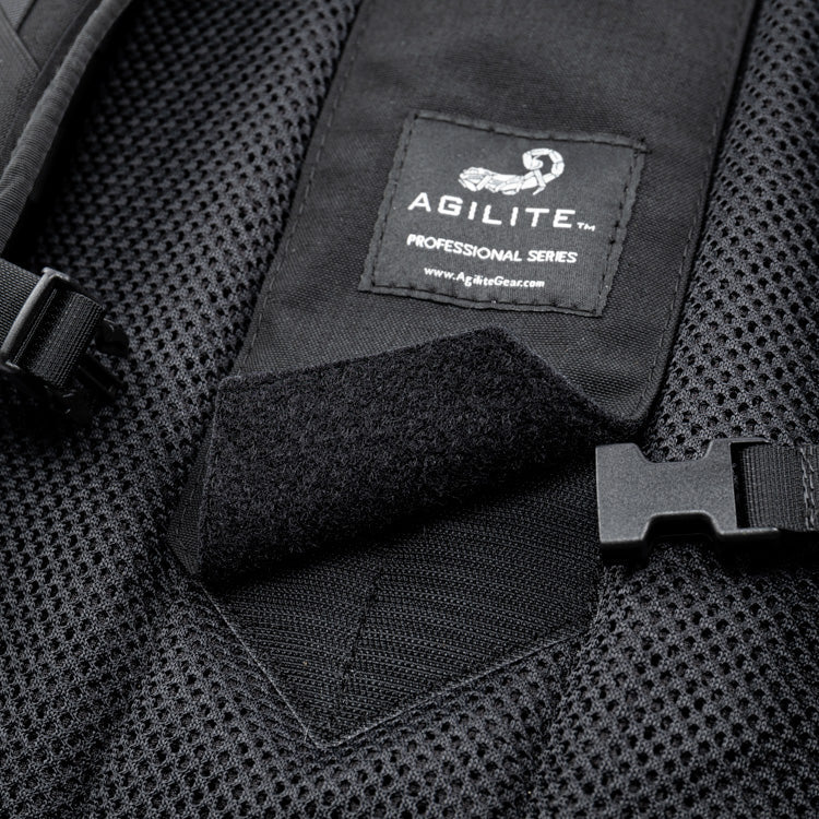 Black assault backpack panel with AGILITE logo patch and hook-and-loop velcro