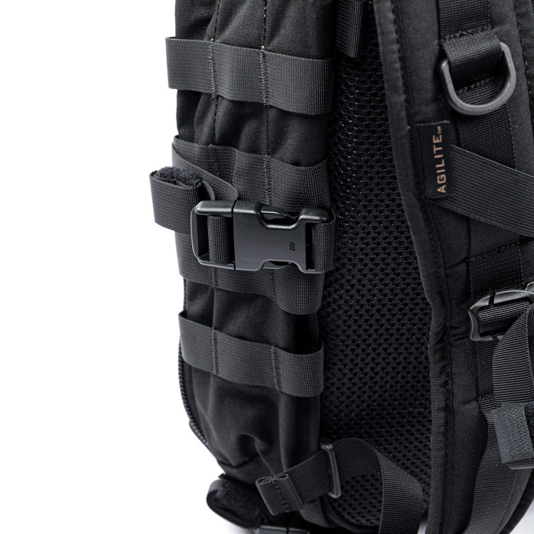 Black assault backpack with padded straps and vertical MOLLE webbing on side