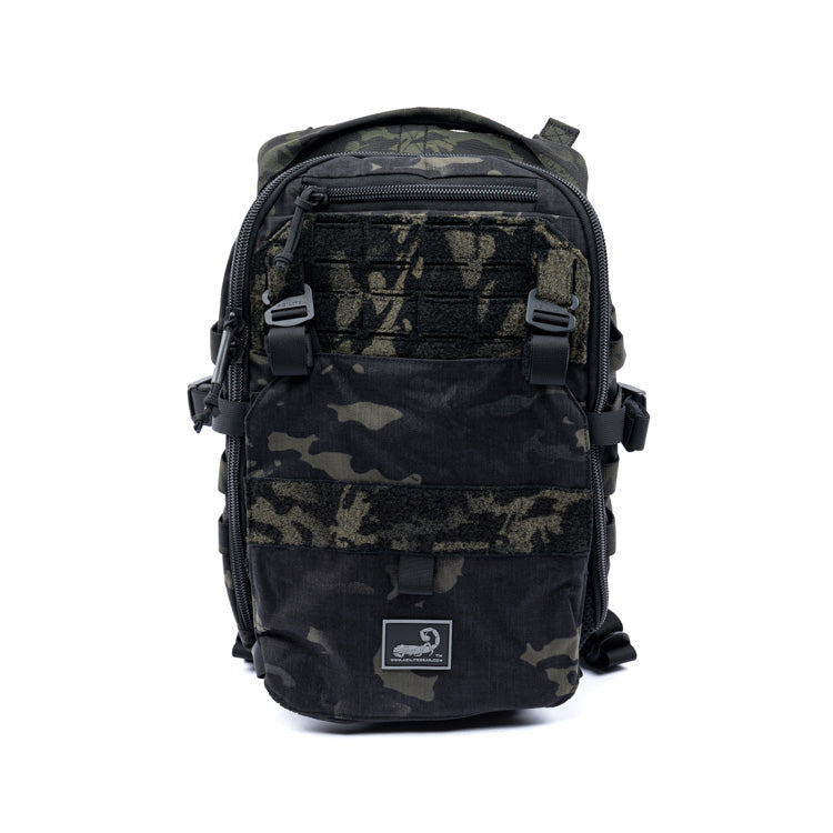 Multicam black assault pack with front zip pocket and MOLLE webbing straps